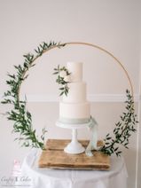 3 tier Sage & white wedding cake in hoop stand